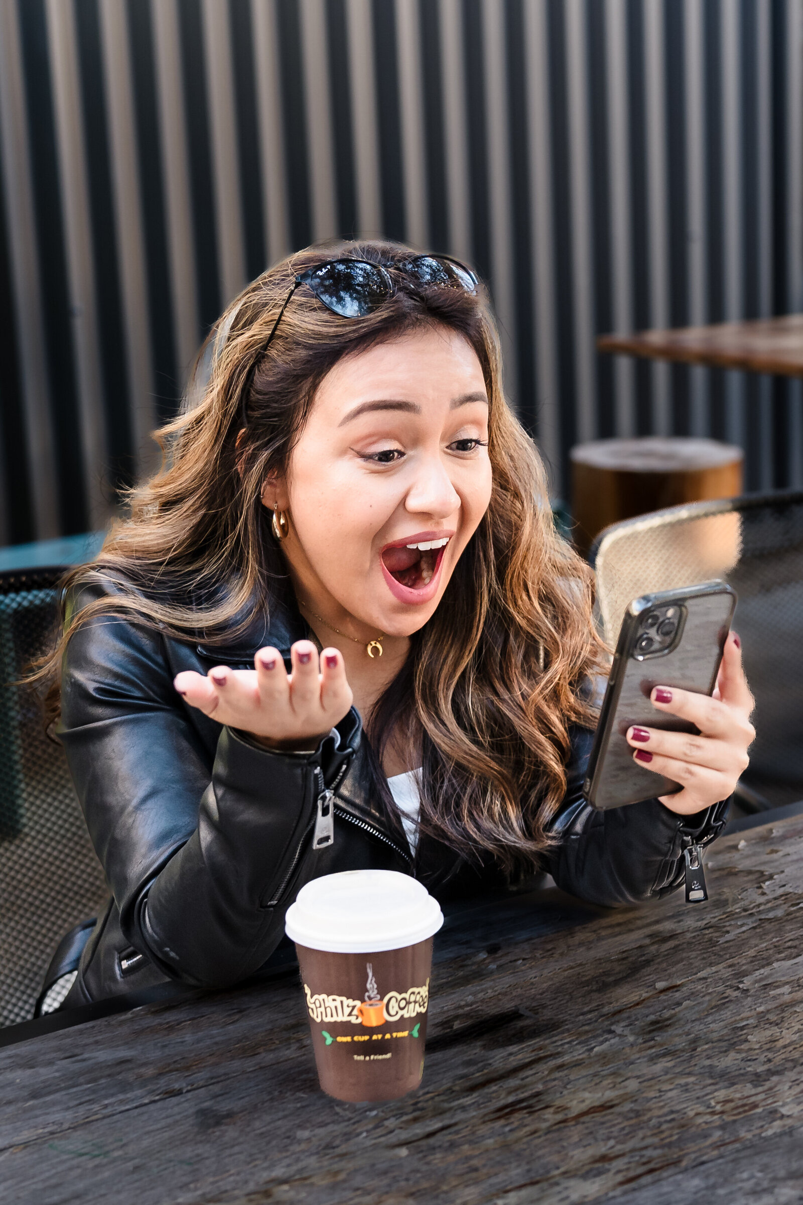 life coach shows surprise checking her phone