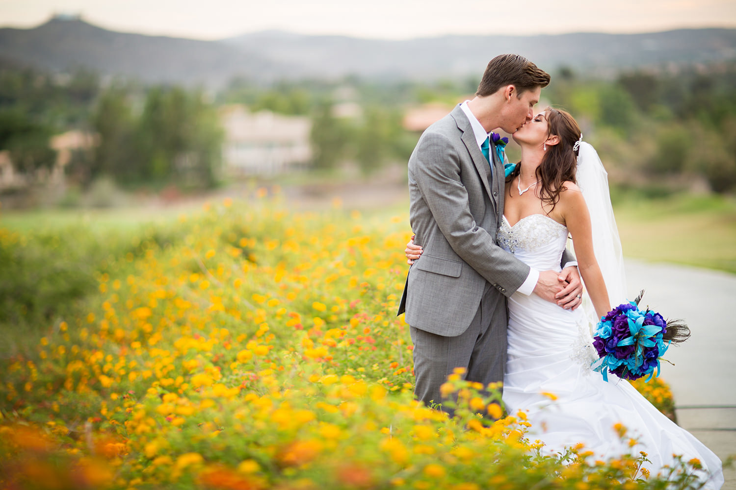bride and groom in flower field at steele canyon
