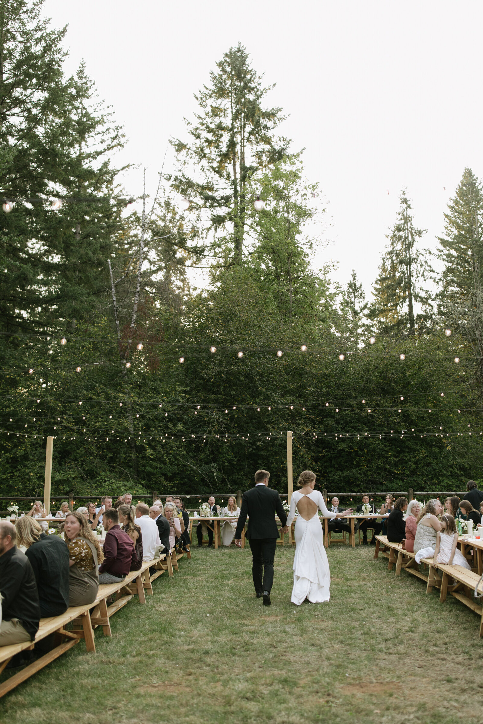 Bride and groom enter reception together taken by Washington adventure elopement photographer