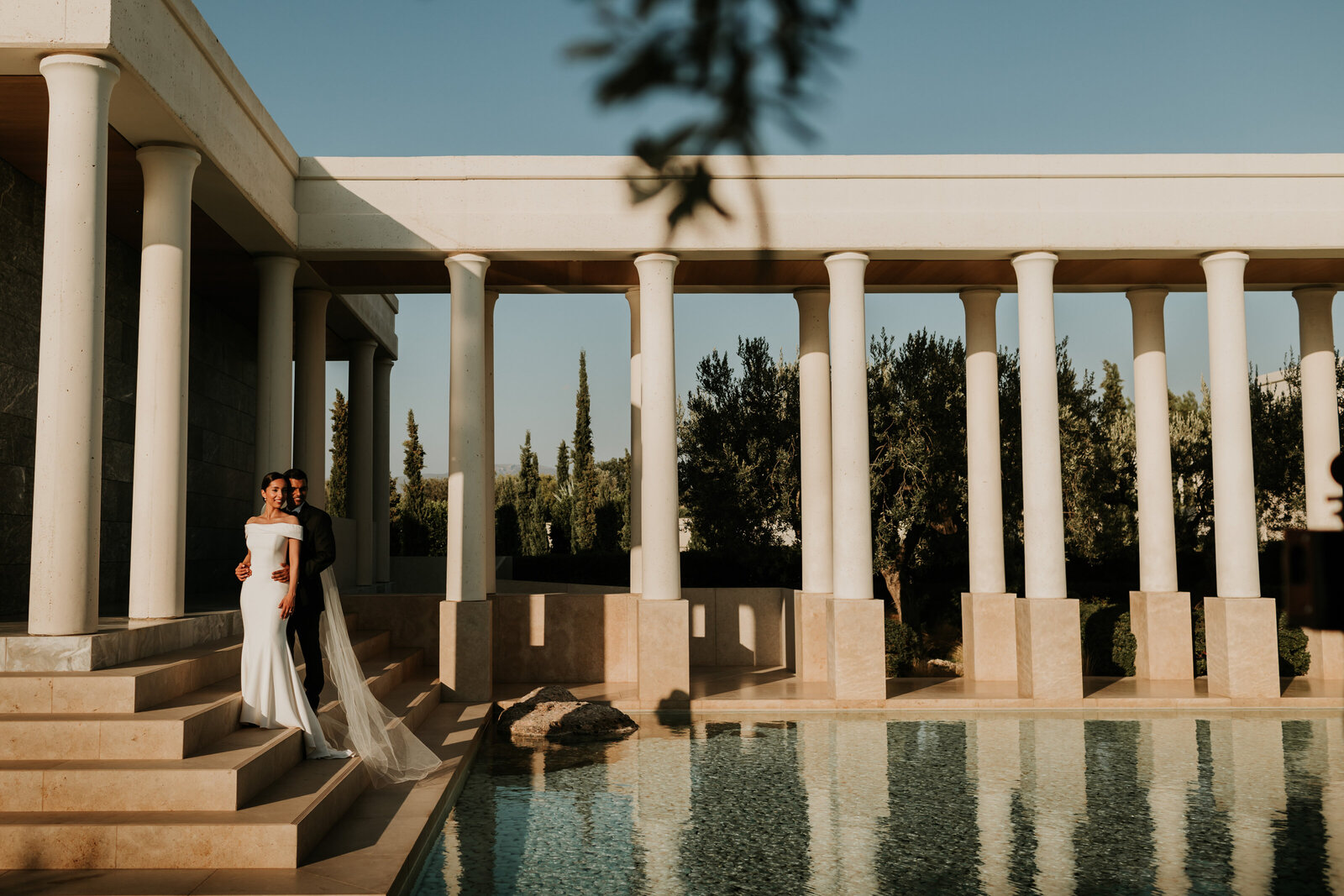 Couple on stairs at Greece Wedding Amanzoe