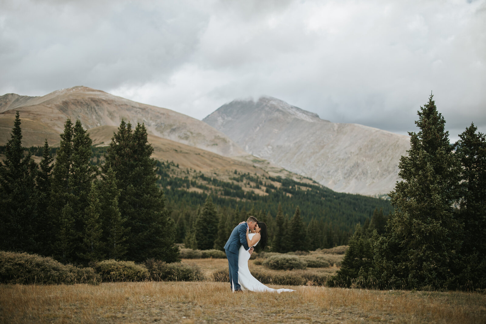 Couple sharing an intimate kiss on their elopement wedding.