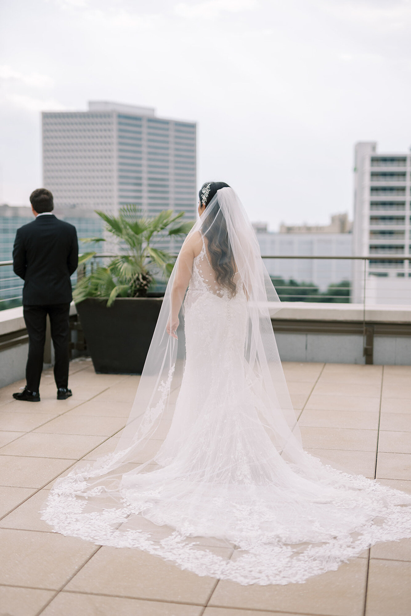 bride walking up to groom at rooftop at the NOPSI hotel in New Orleans
