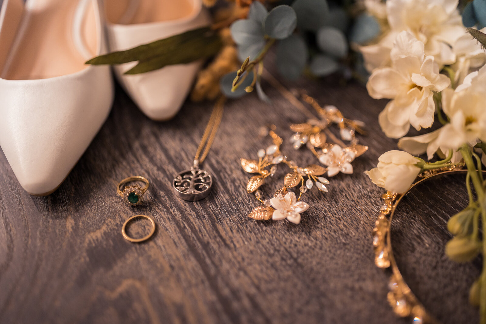 wedding day details including rings, jewelry, shoes, and bouquet