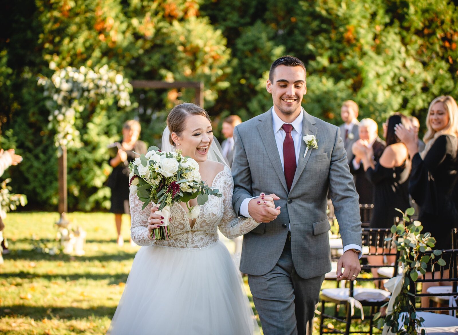 intimate wedding couple cheering after ceremony