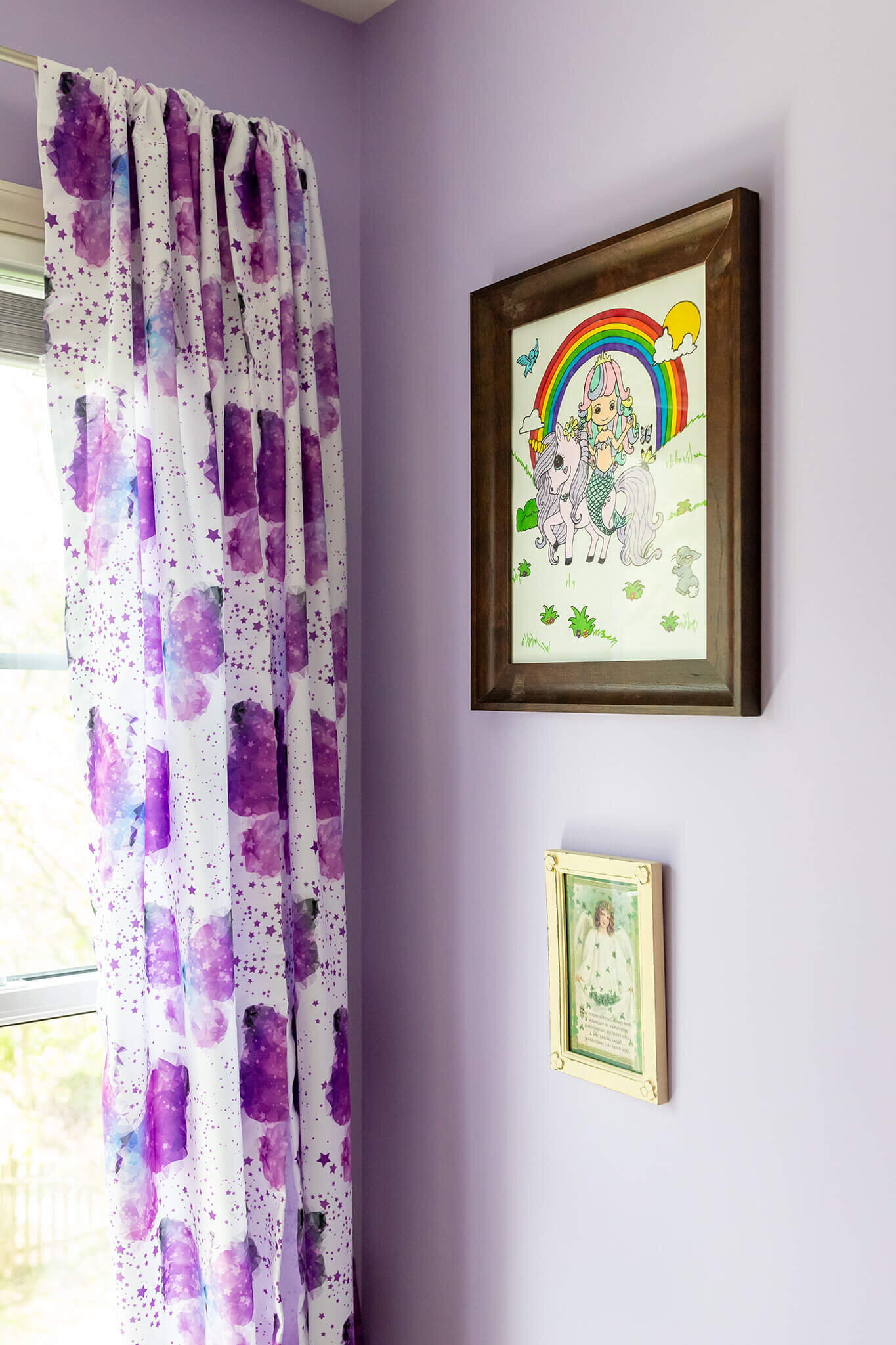 A nursery with pictures on the wall in a home in Manassas.