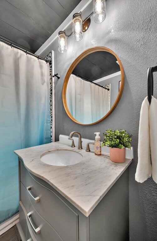 Bathroom vanity in this two-bedroom, one-bathroom vacation rental house for five located just 5 minutes from Magnolia, Baylor, and all things downtown Waco.