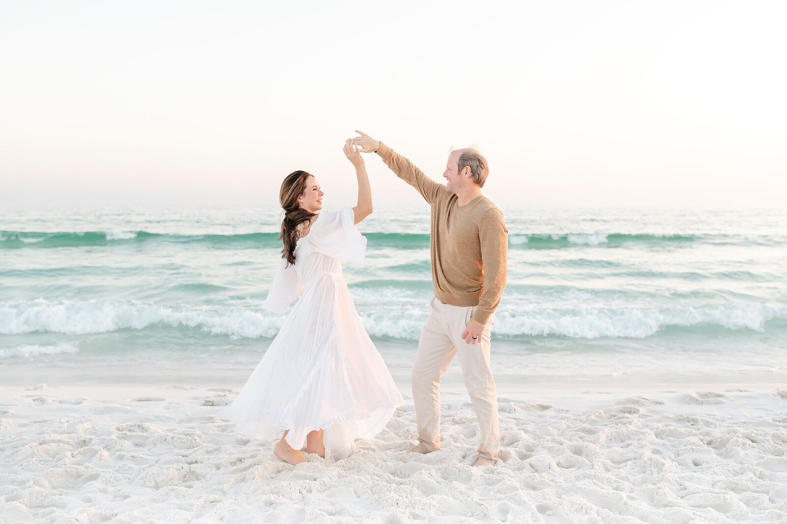 a couple dancing in front of destin family photographers