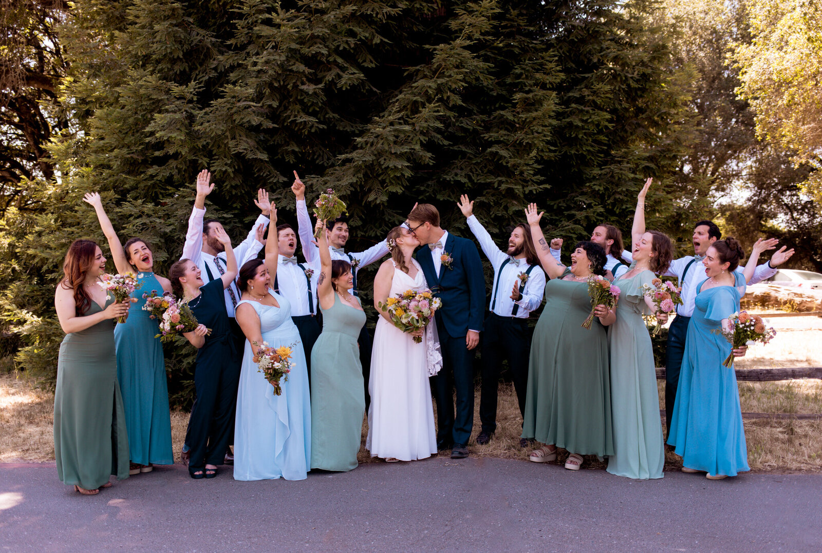 bridesmaids holding each other from behind
