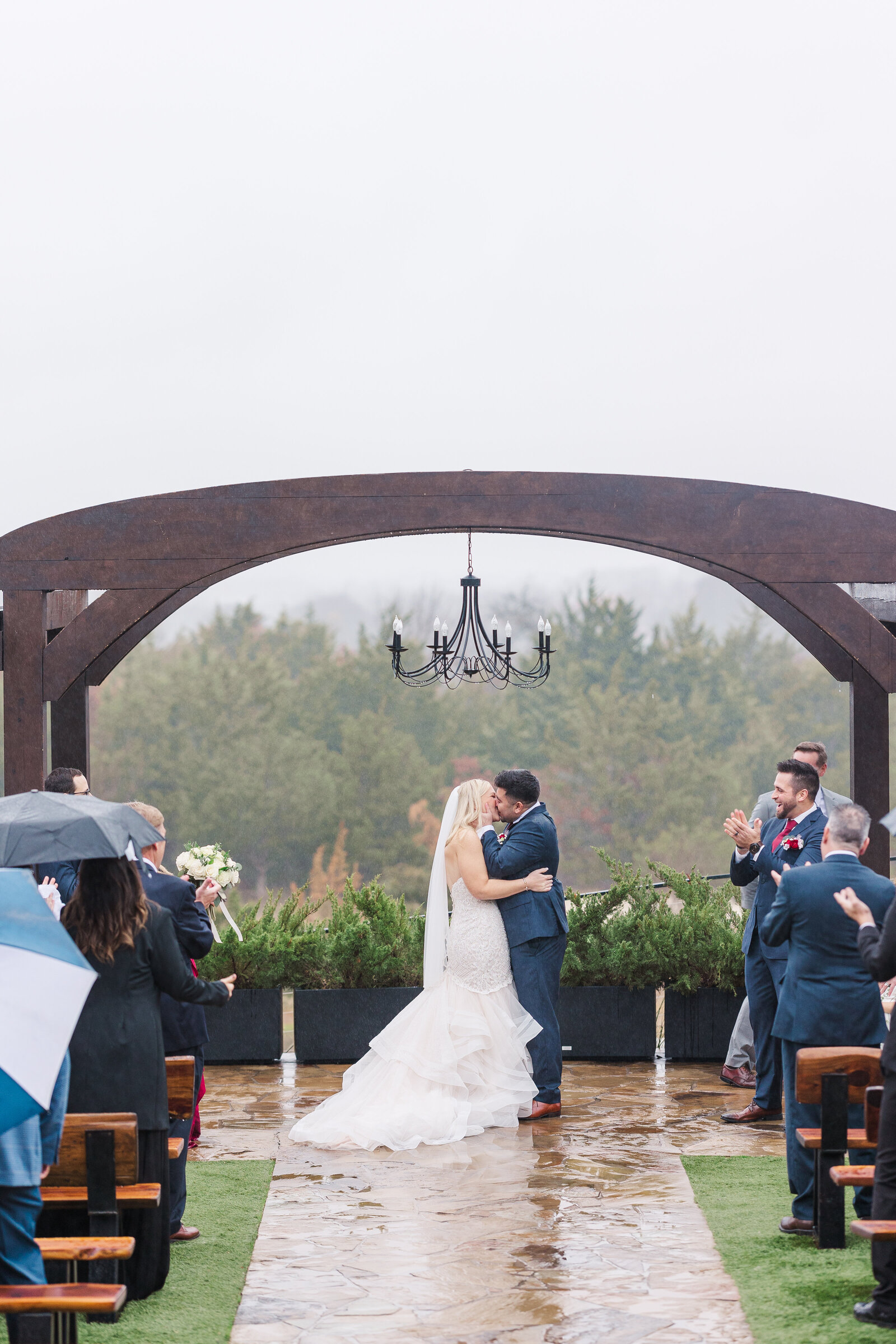 Bride and groom after ceremony first kiss