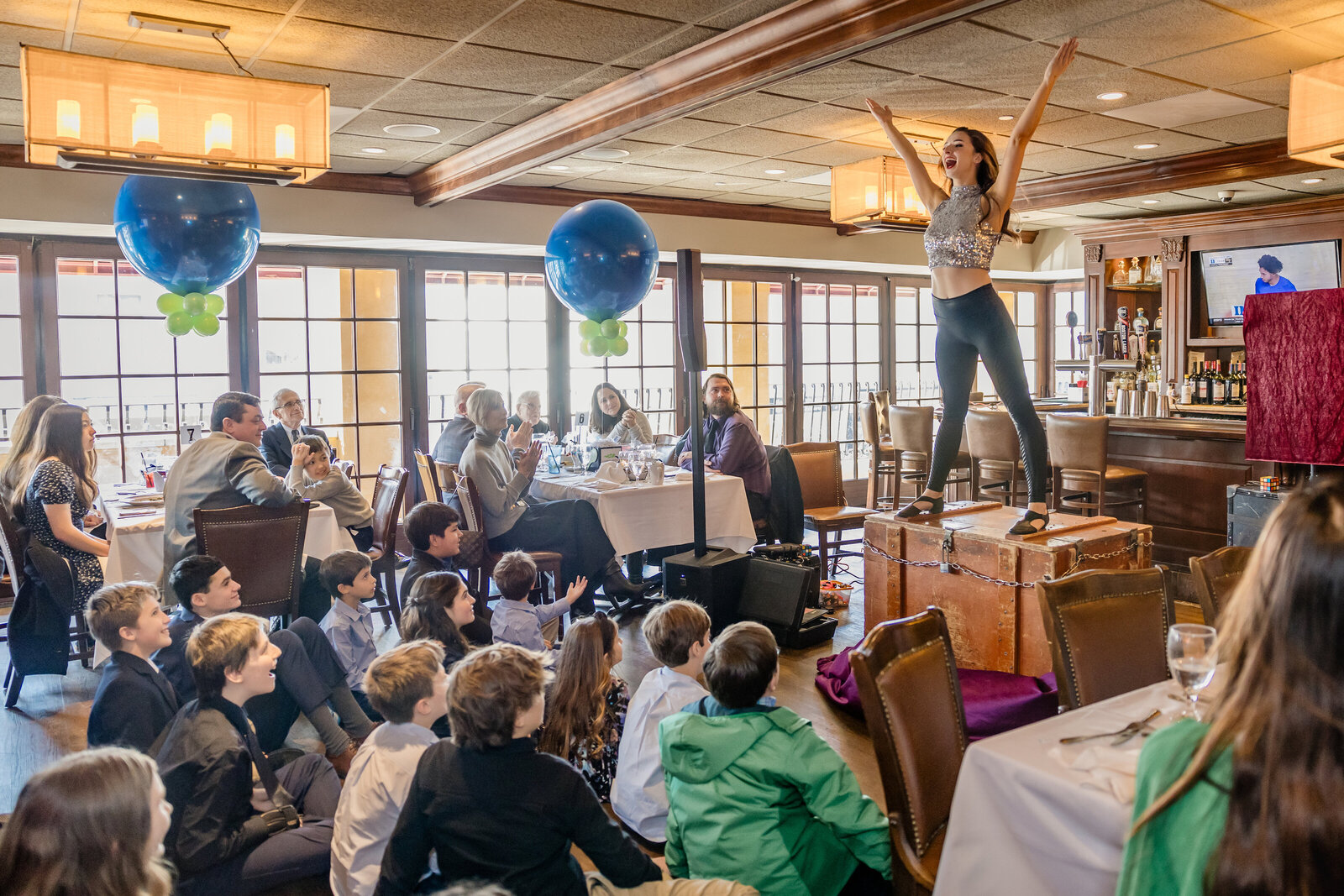 A magician's assistant re-appears, to amazed guests.