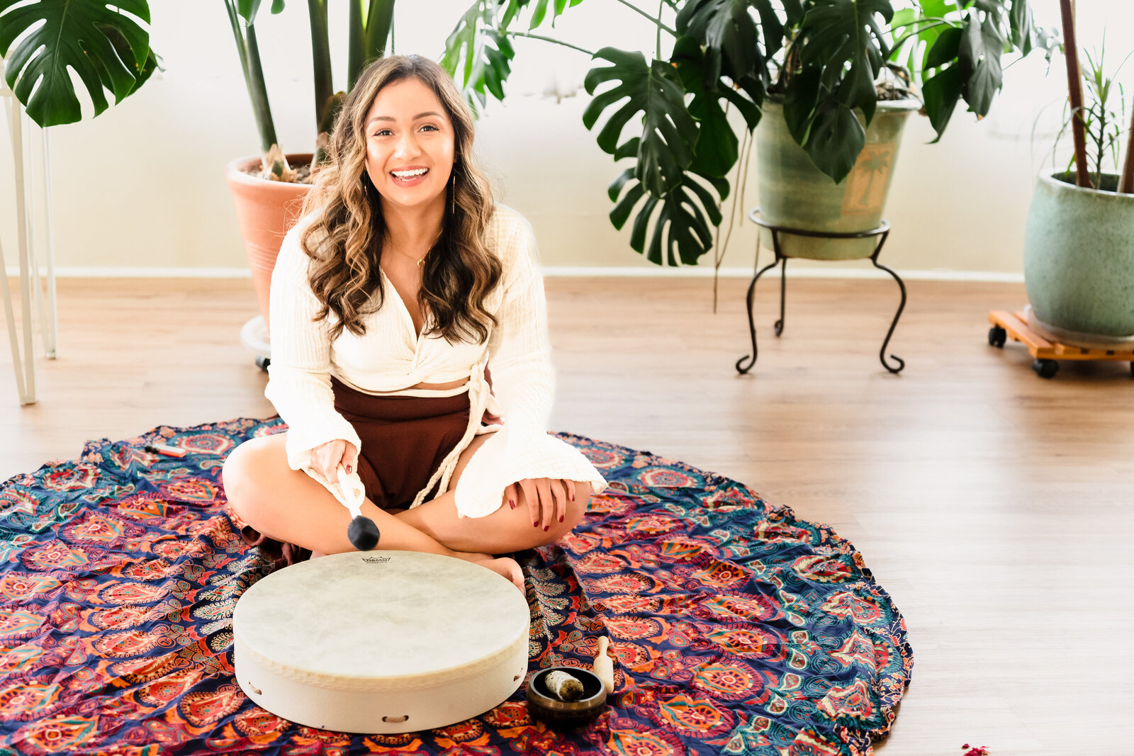 Life coach in a sound bath meditation pose