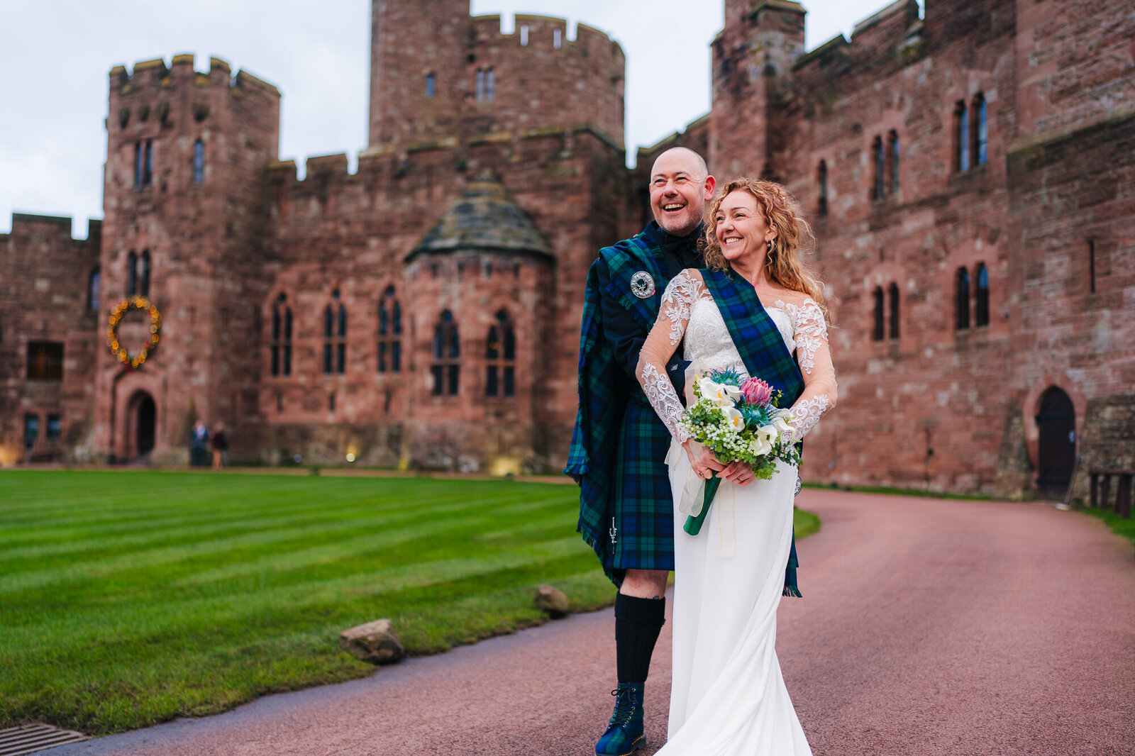 Newly married older couple outside peckforton castle captured by wedding photographer Anthony  Horseman
