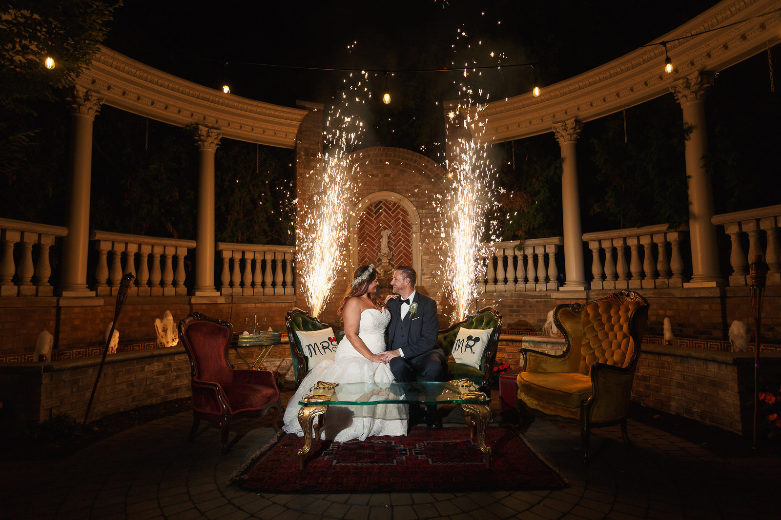 Bride and Groom sit in front of cold spark sparklers at the Brownstone in New Jersey