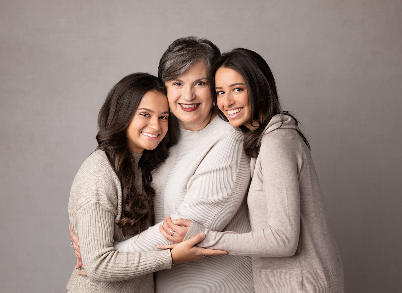grandma and two granddaughters posed for studio portraits cleveland family photographer