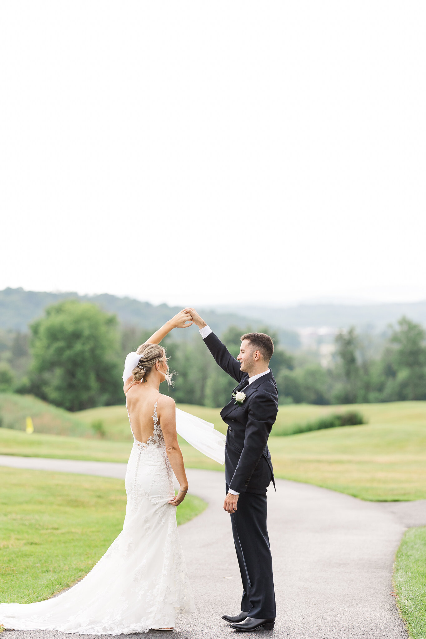 Bride and groom dancing together privately during first look at SkyView Golf Club