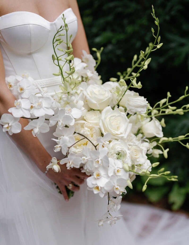 bride holding floral bouquet taken by fort myers wedding photographer