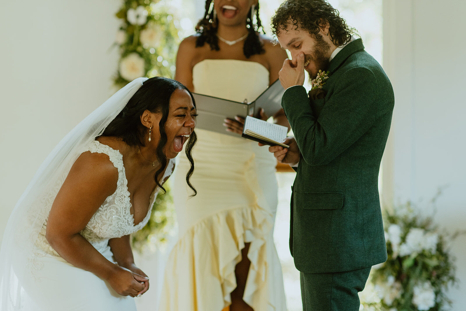 interracial couple laughs at wedding ceremony