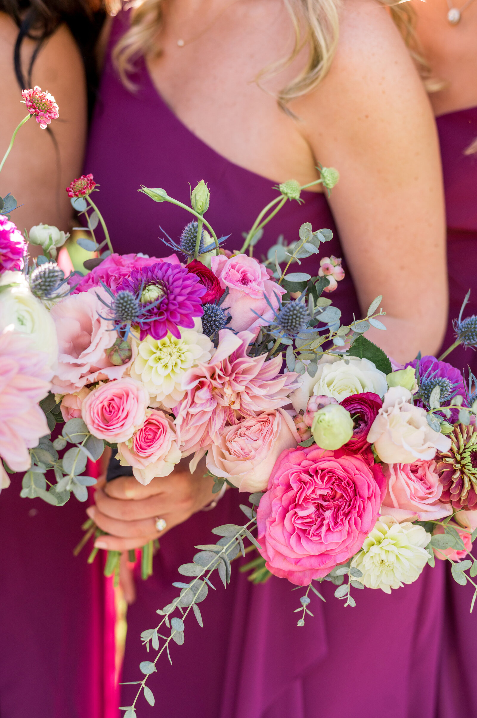 Purple & Pink bridesmaid bouquets with huge roses and dahlias.