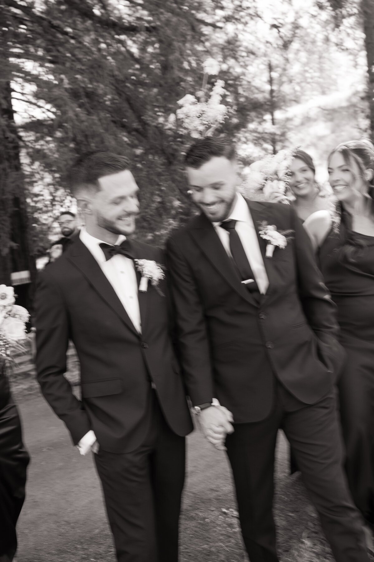 Grooms smiling at wedding by destination wedding photographer