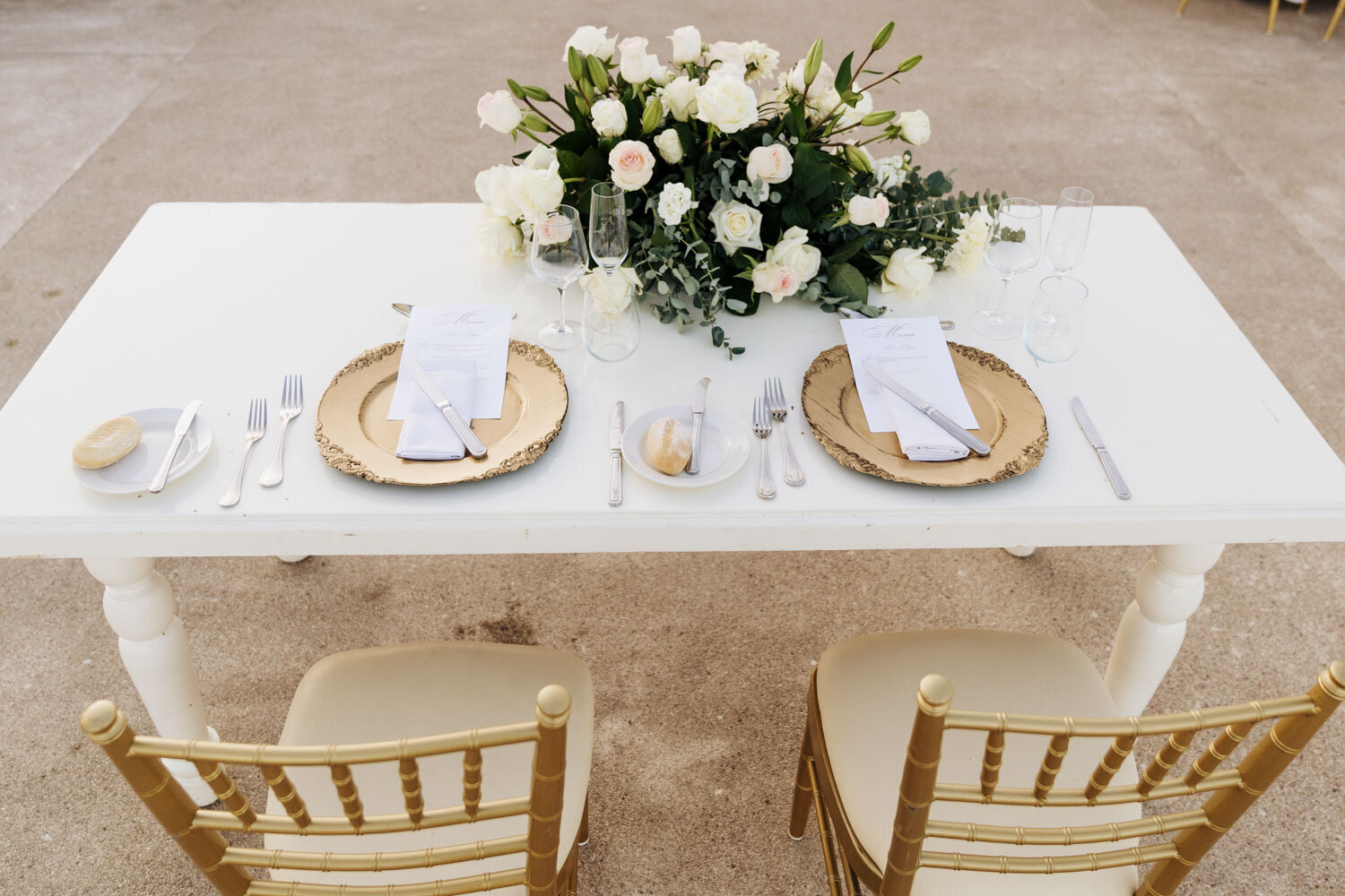 Simple table setting with a floral centerpiece for two