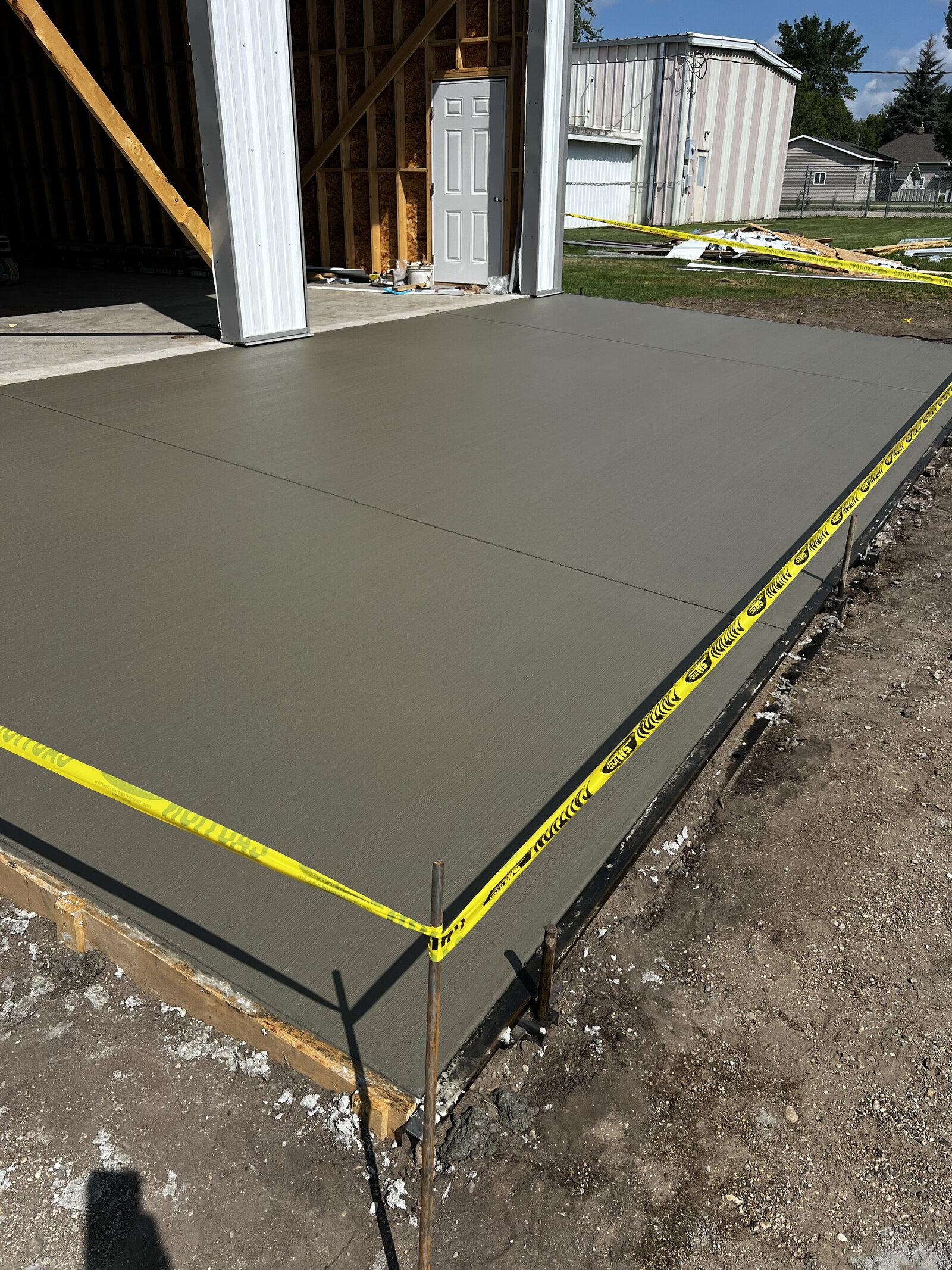concrete driveway in front of a shop