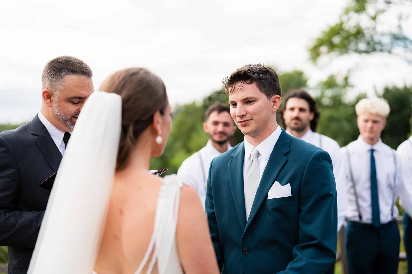 bride and groom during their wedding ceremony at terra incognita vineyard wedding venue 