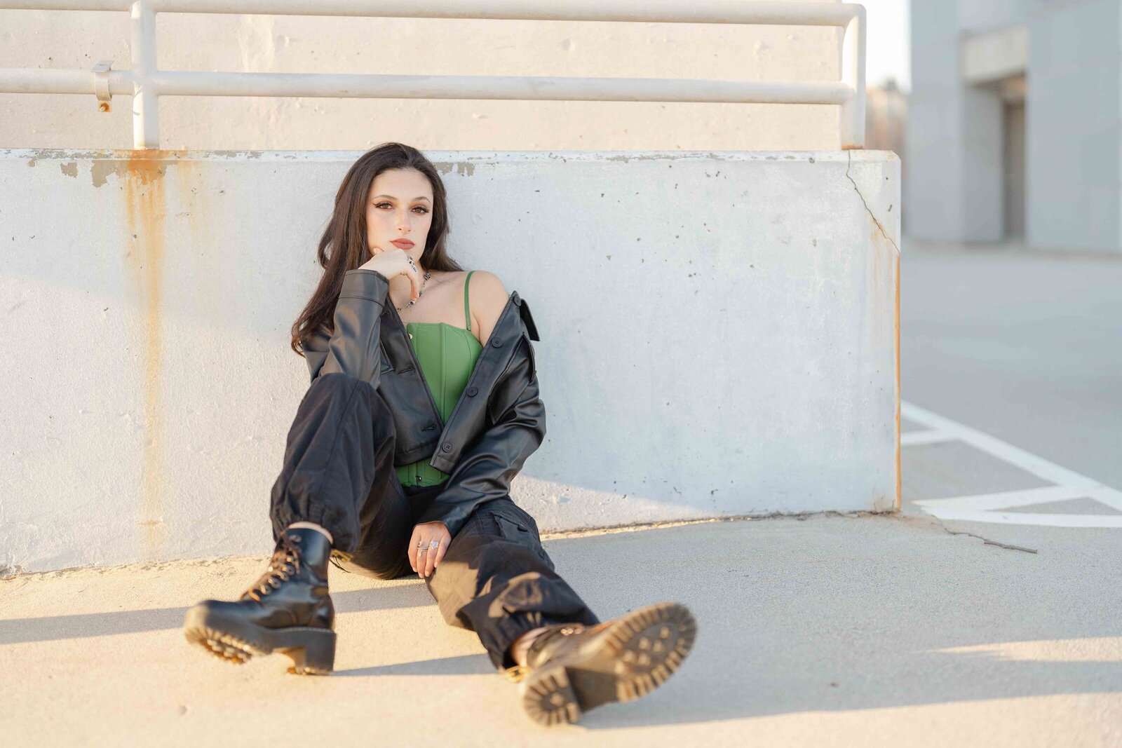 girl leaning on a stone wall taken by Reston, VA senior photographer