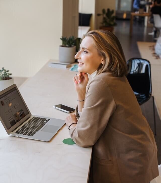 Smiling woman at desk