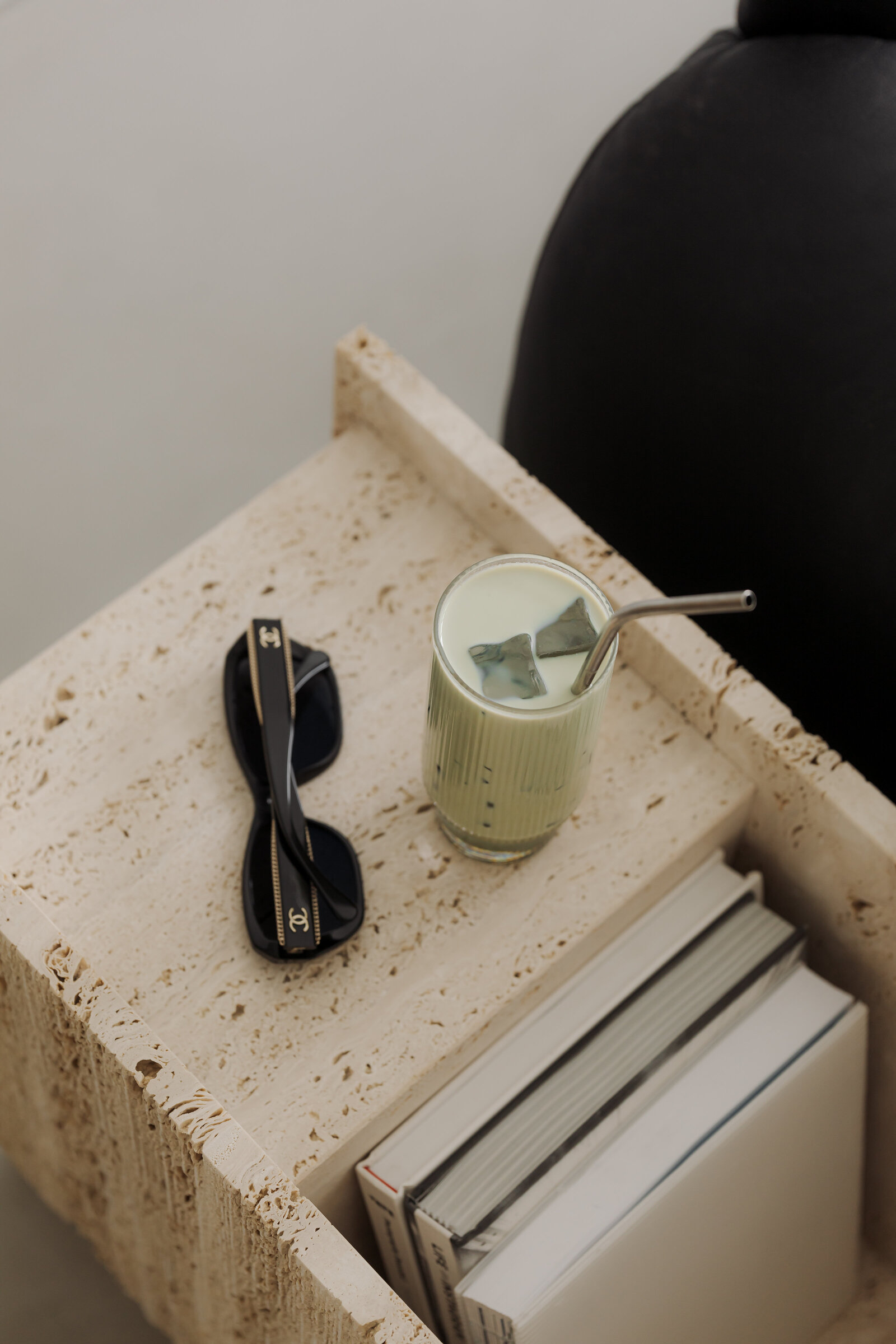 kaboompics_matcha-latte-on-travertine-table-next-to-black-leather-sofa-japandi-style-37370