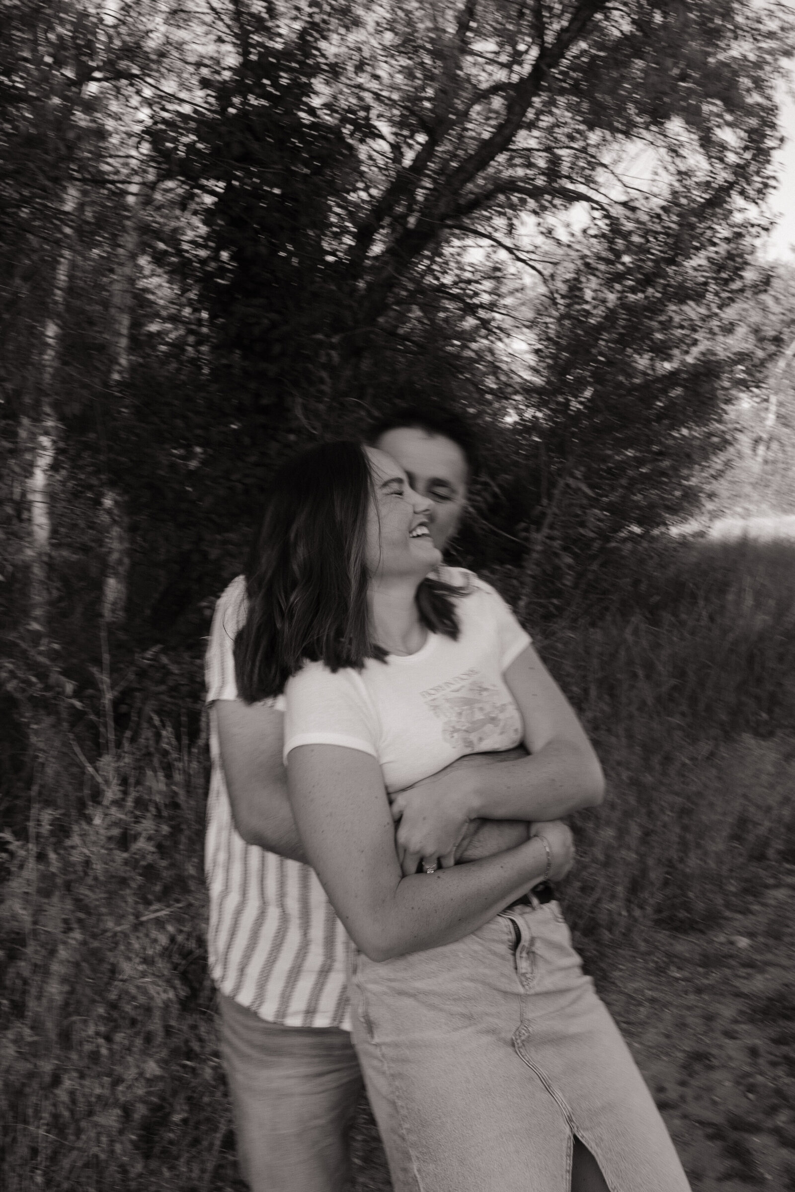 Close-up of couple hugging and smiling during adventure shoot