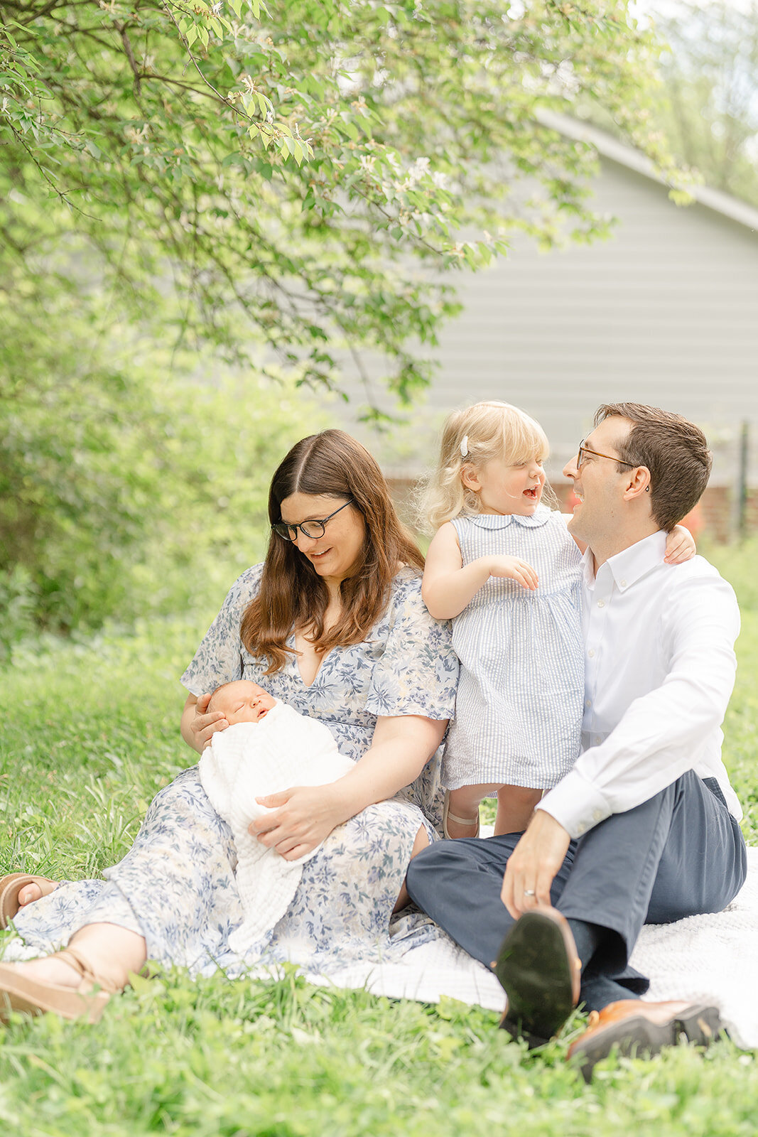 family playing during Leesburg, Virginia backyard newborn photography