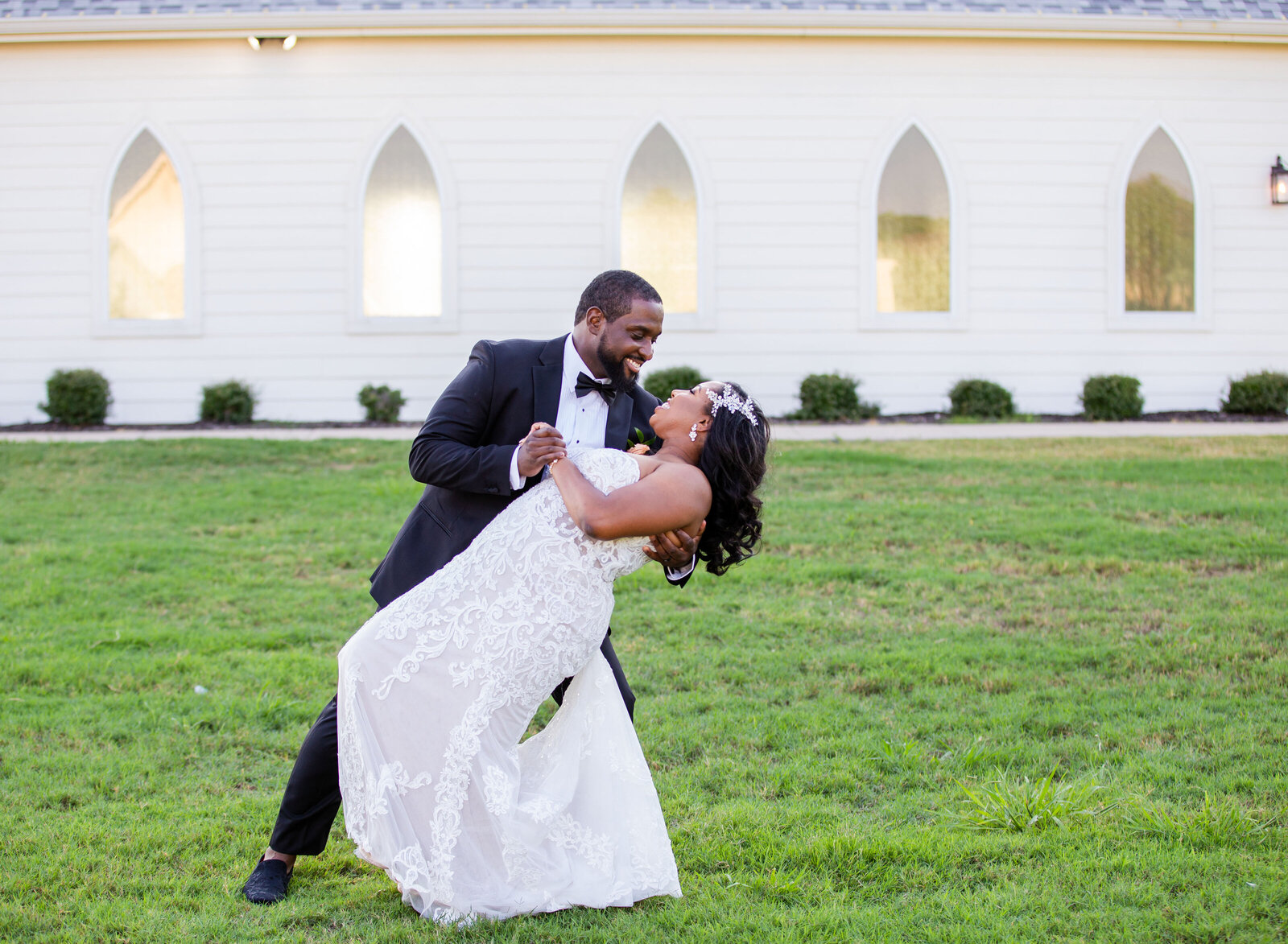 groom dipping bride