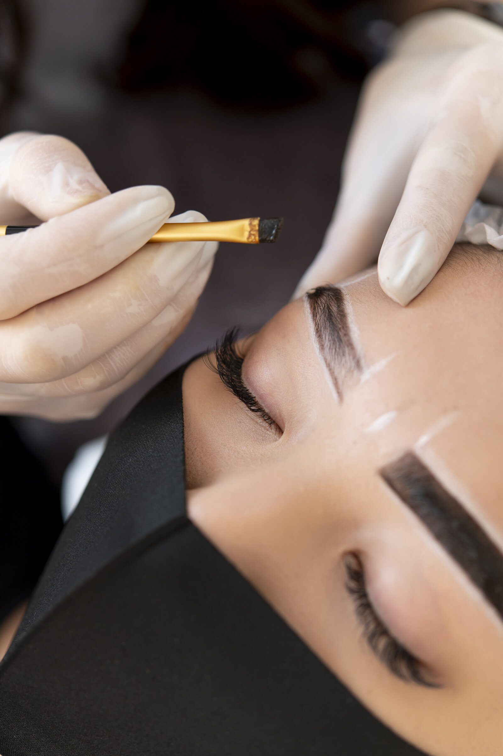 beautician-doing-microblading-treatment-client-s-eyebrows