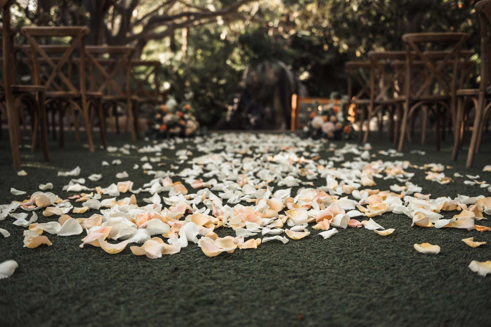 Wedding ceremony aisle with loose petals