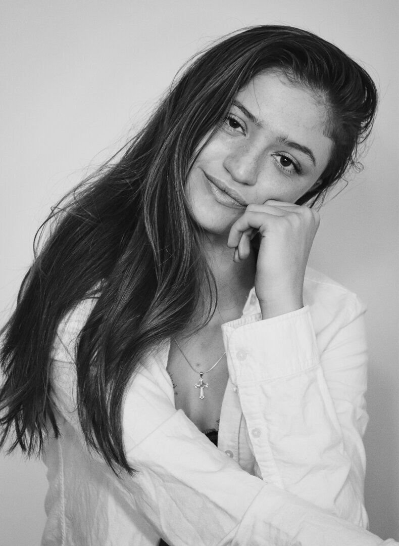 woman with her hand on her chin