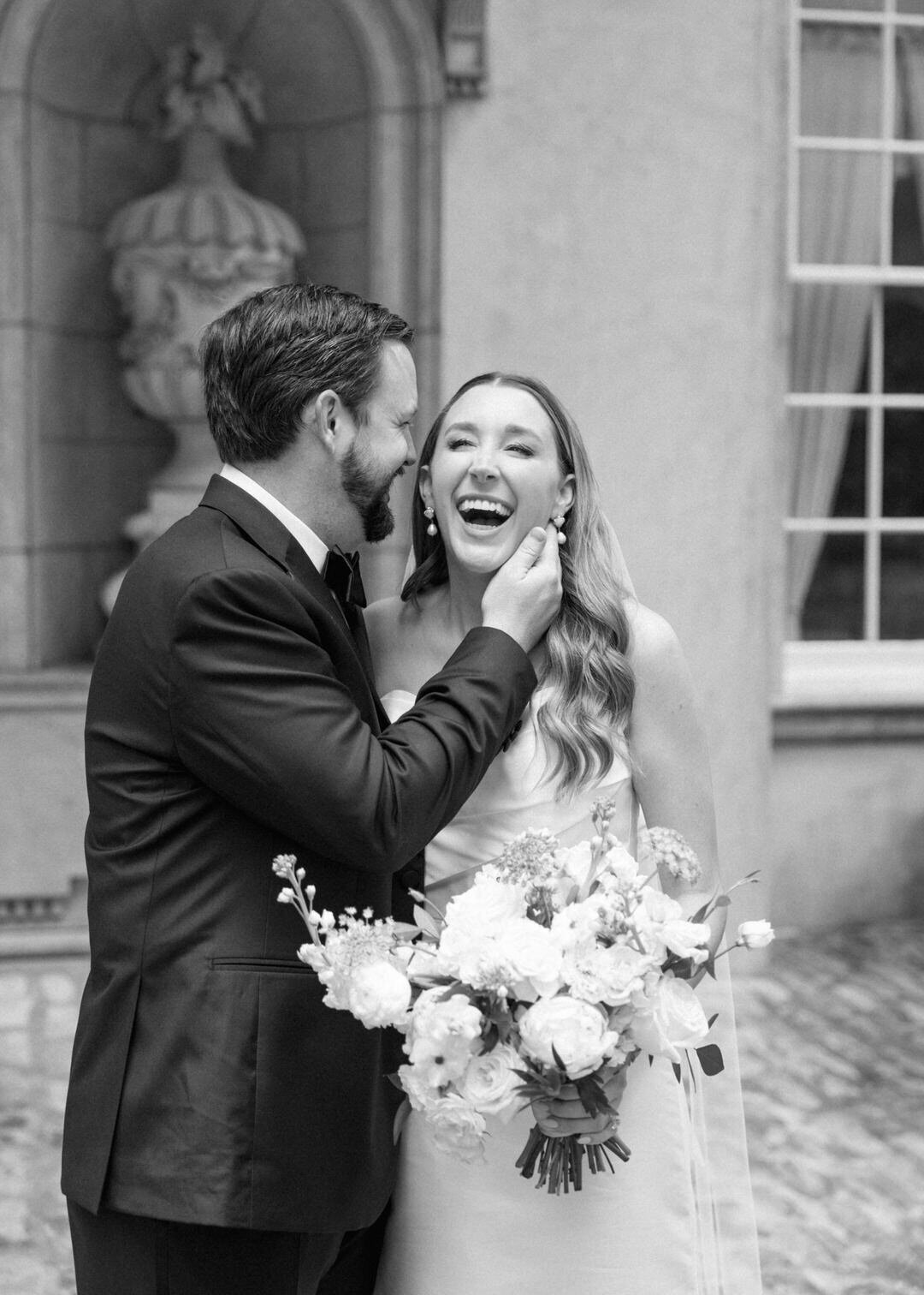 Black and White of Groom making bride laugh at Swan House in Atlanta