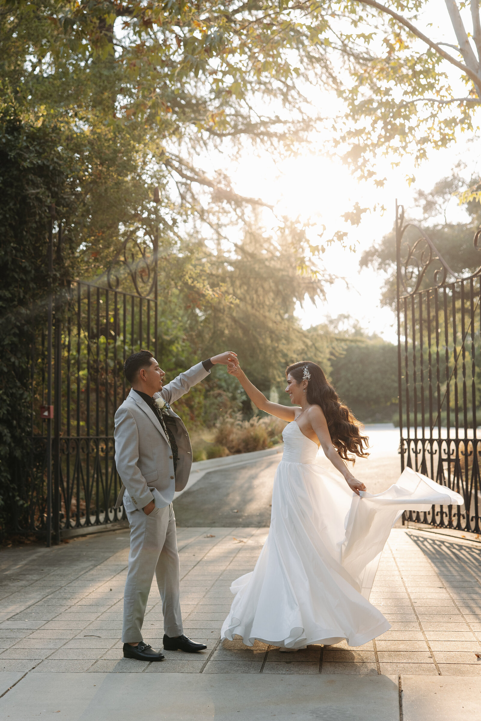 groom twirling bride