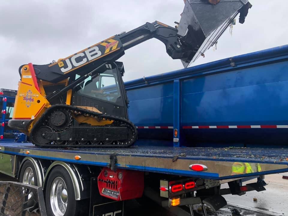 Petroff Towing Skidsteer and Gondola trailer clearing accident scene damaged load