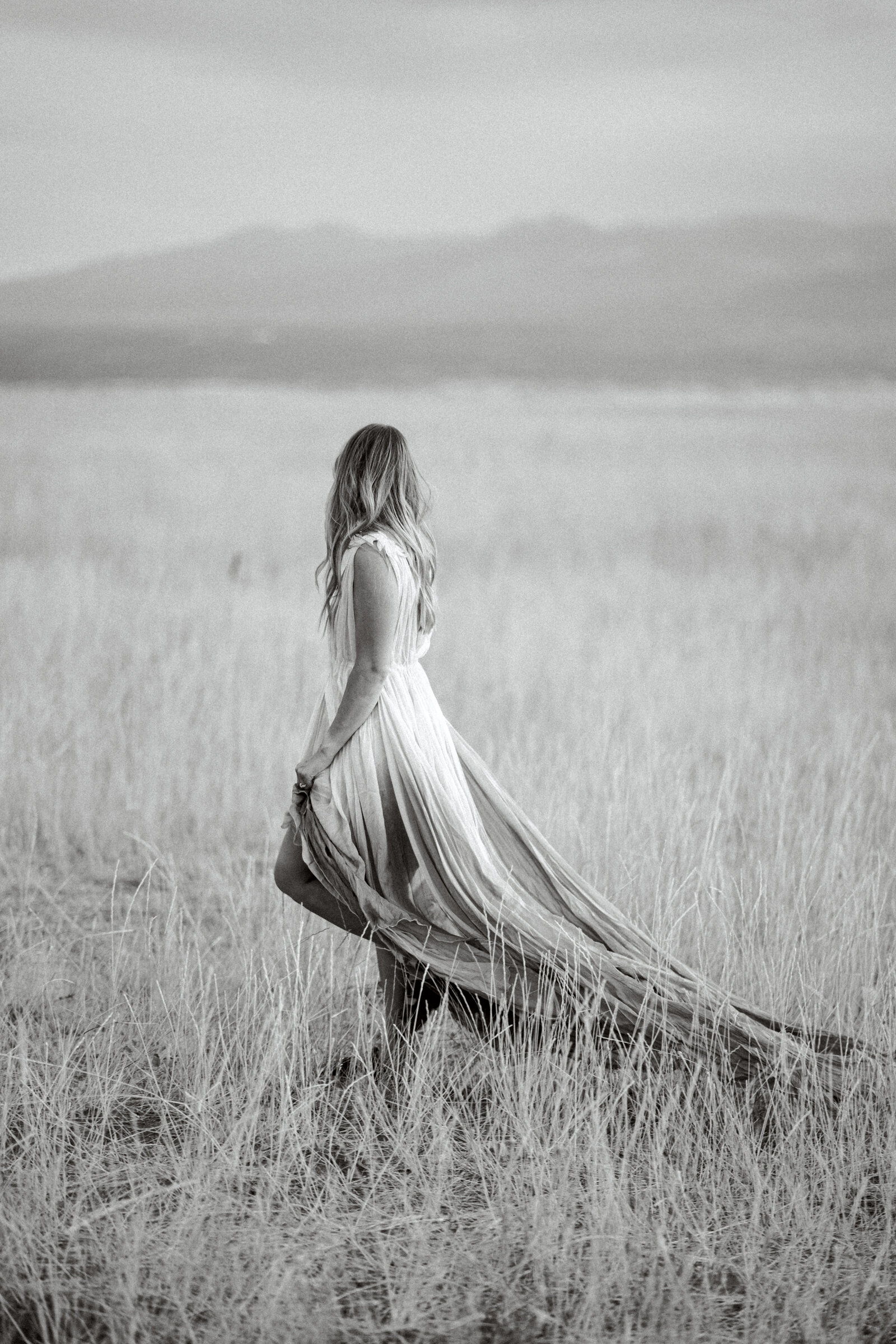 Bride walking in feild The Maples wedding in Woodland, CA