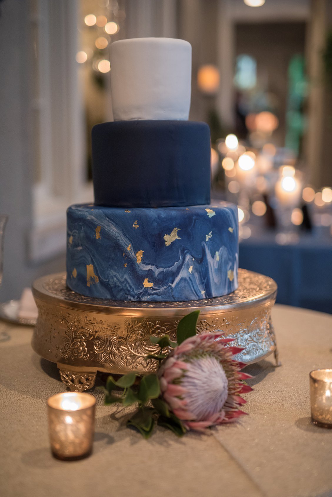 Blue, navy and white wedding cake with marble details and gold foil