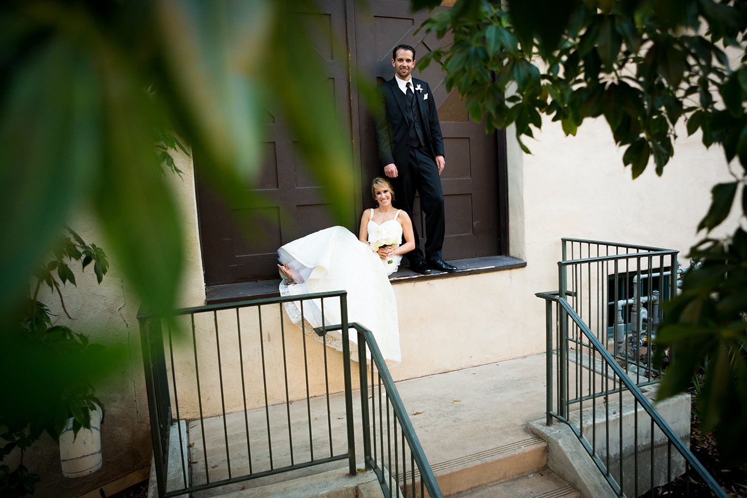 bride in groom in balboa park for their prado wedding