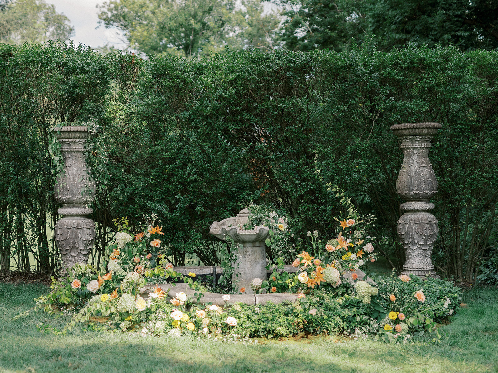 Organic sprawling fountain installation wedding ceremony secret garden