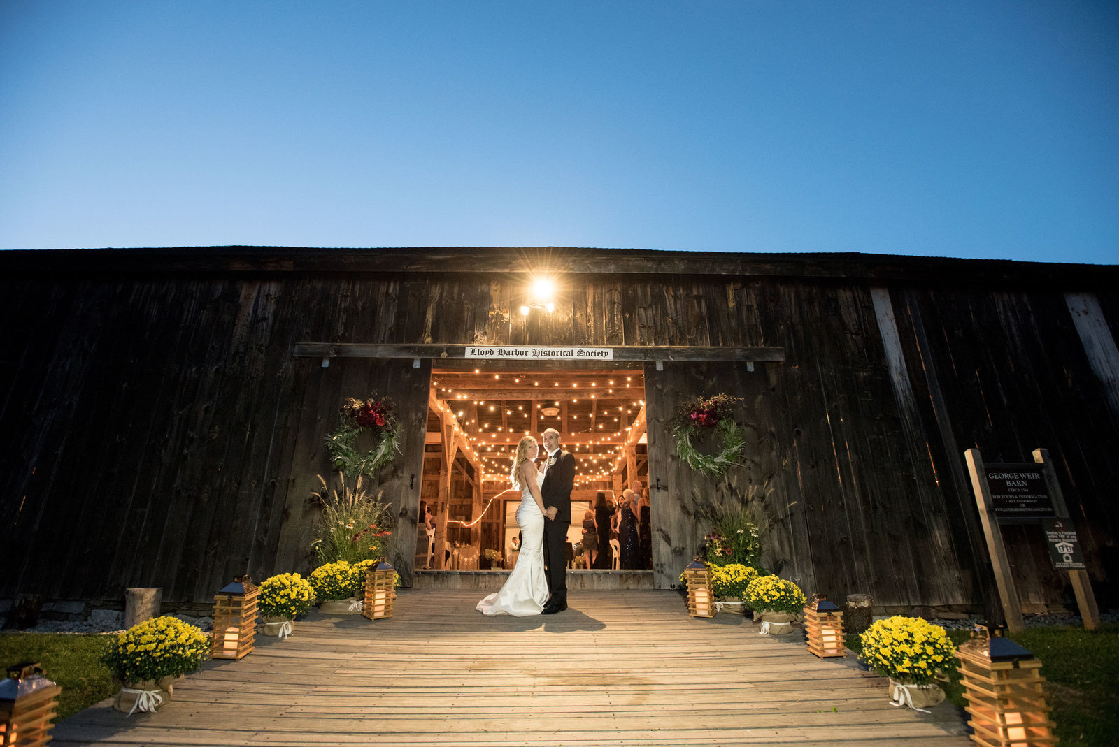 bride and groom outside at night fall at George Weir Barn