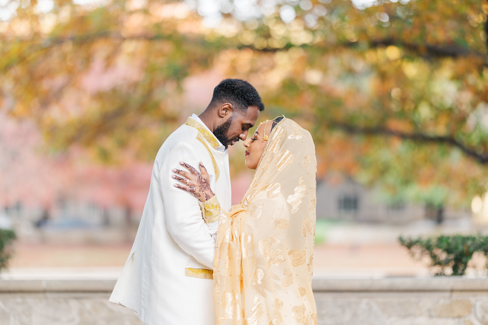 Bride-holding-groom-portrait-outdoor