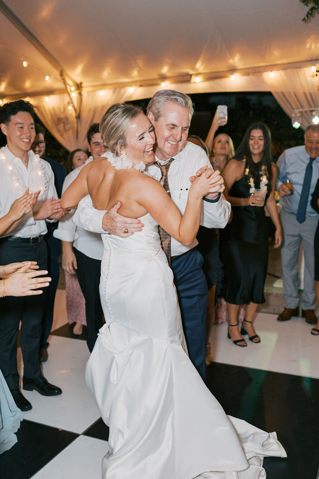 woman dancing with her grandfather during wedding reception