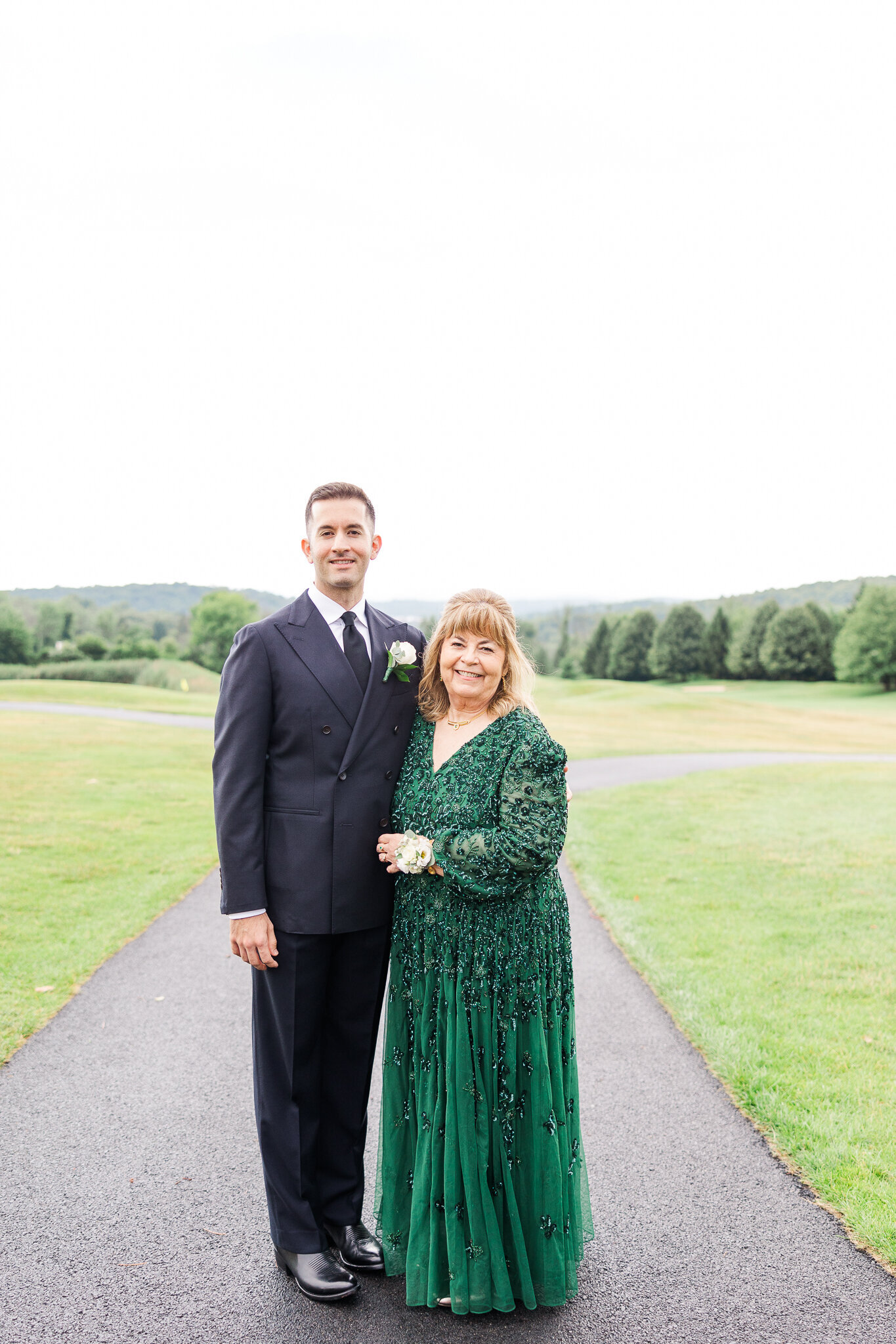 Sweet portrait of groom with his mother before the ceremony at SkyView Golf Club