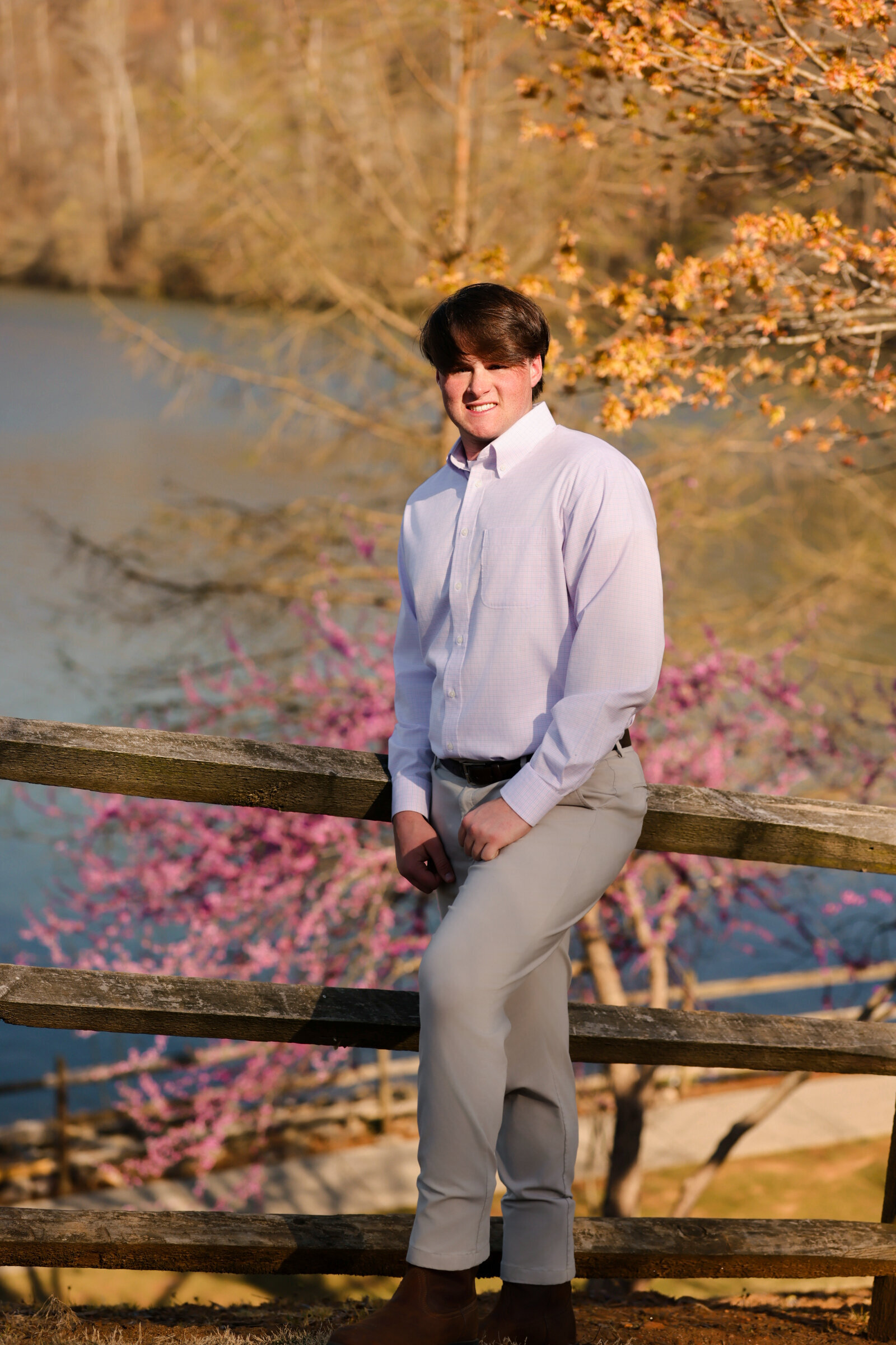 High School Senior Boys how to pose in front of a tree by a lake in Atlanta, GA