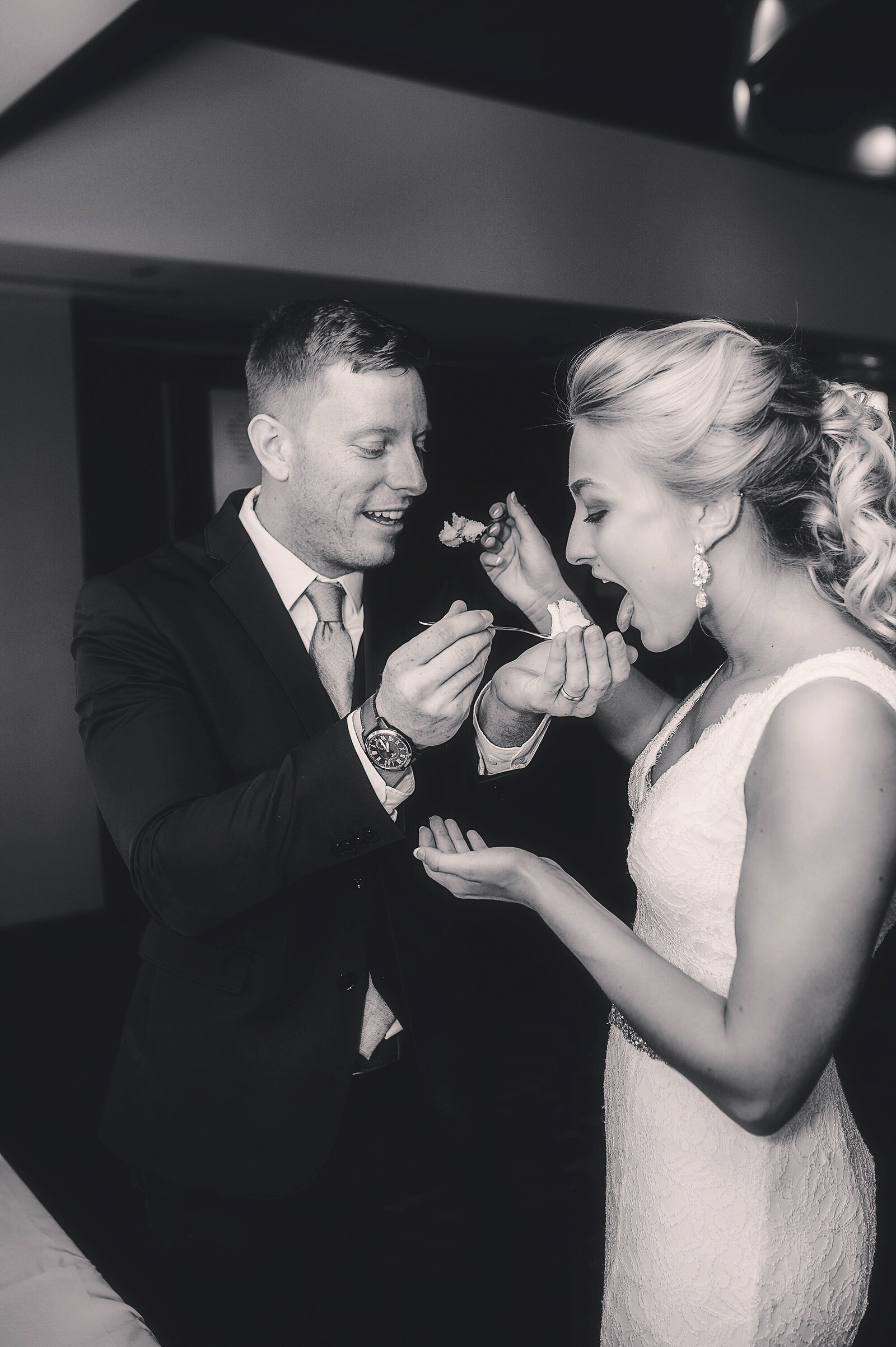 Bride and Groom enjoy wedding cake during their  Micro Wedding at the Capital Club in Asheville, NC.