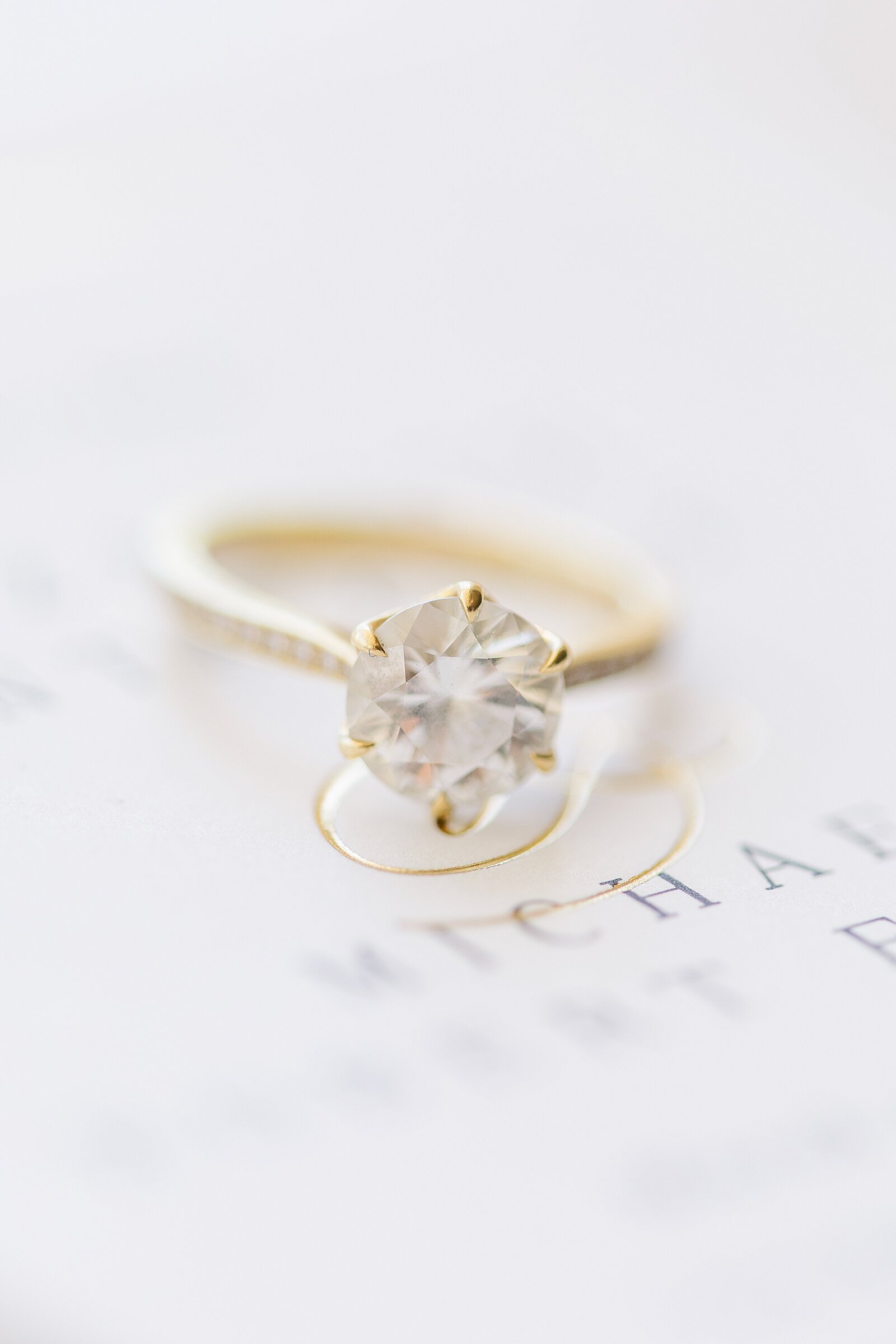 Engagement ring on invitation at Malibou Creek Inn in Malibu, California.