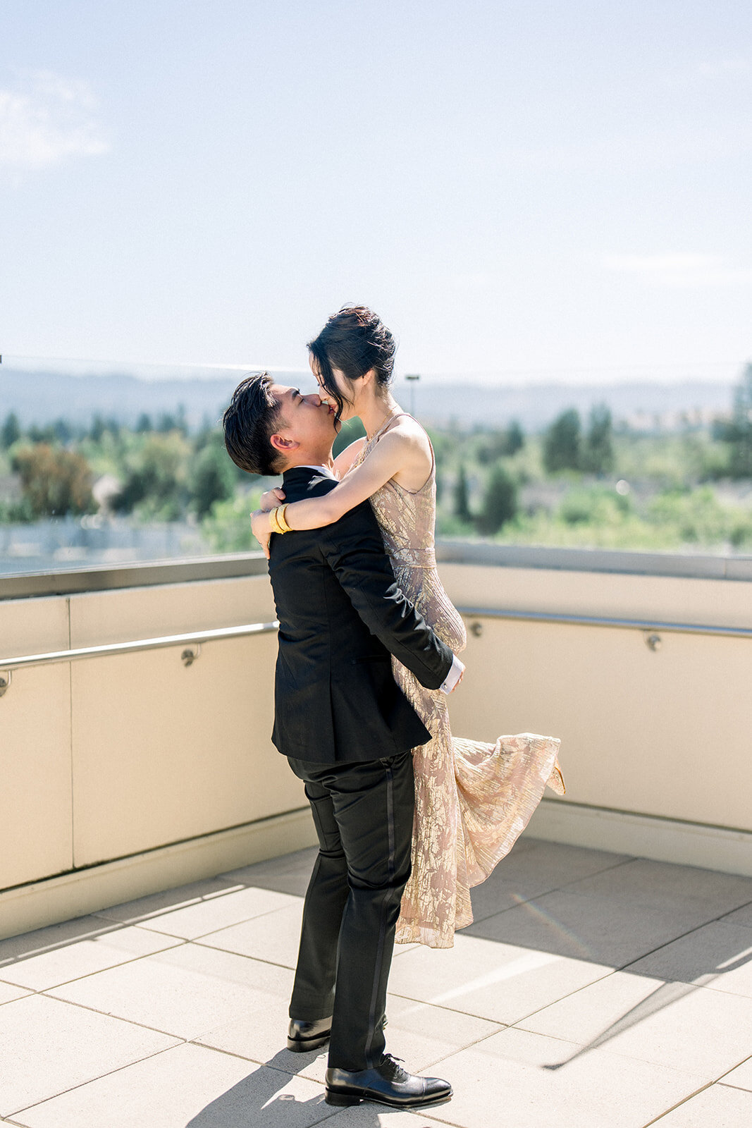 The newlyweds share a joyful moment at the picturesque Filoli estate, celebrating their love amidst the beautiful surroundings of Woodside, California.
